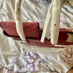 Authentic Michael Kors Brand new large bag with matching wallet.Mulberry